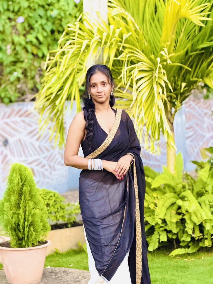 Thaara in a black saree